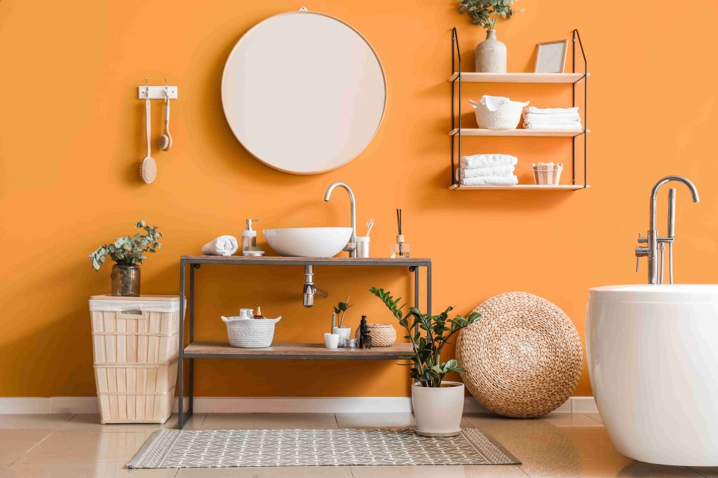 Stylish orange bathroom with an interesting arrangement of furniture