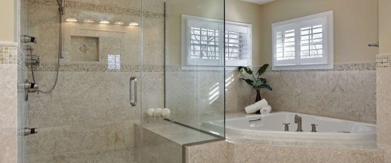 Modern master bath with large glass shower